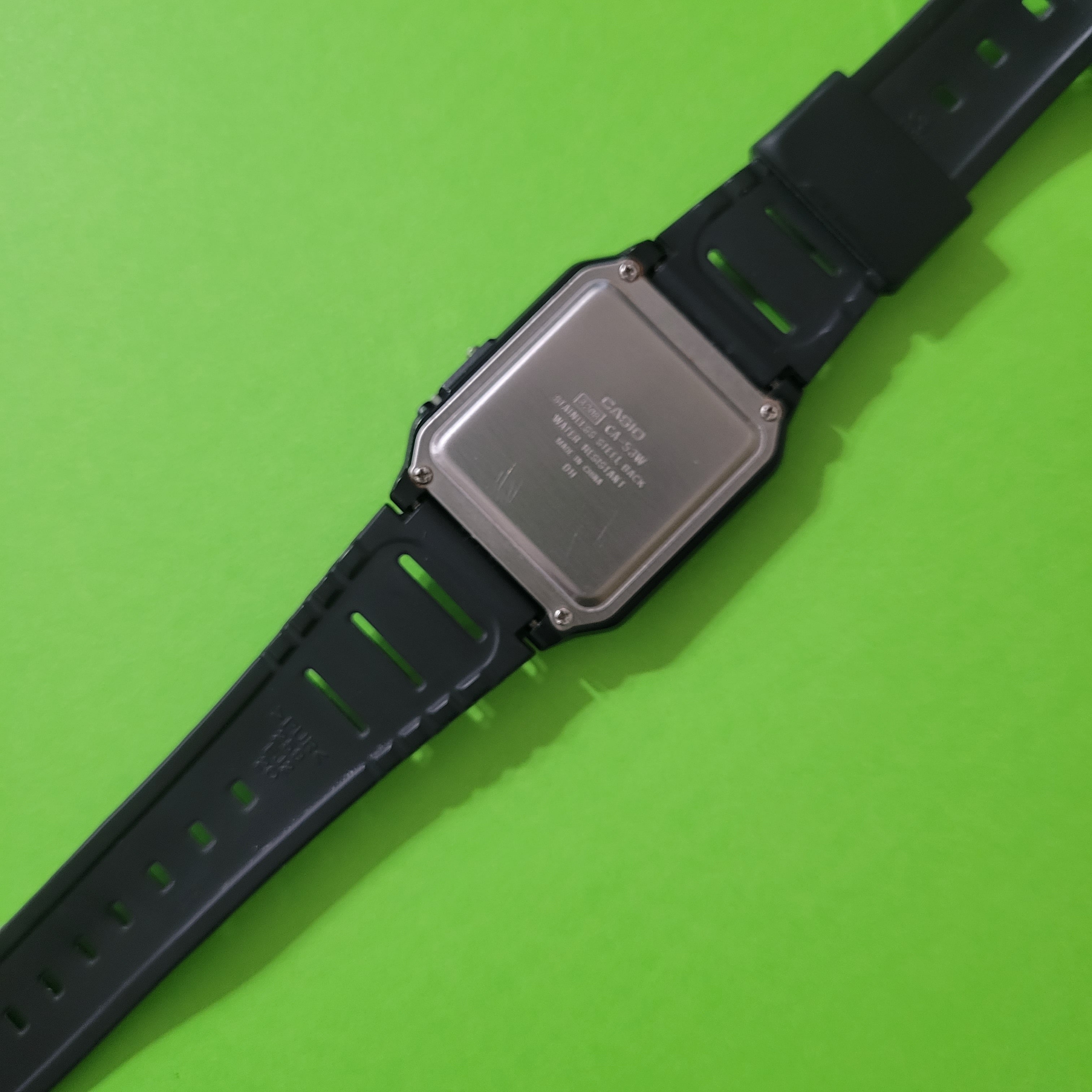 An image of the back of the Casio CA-53W calculator watch